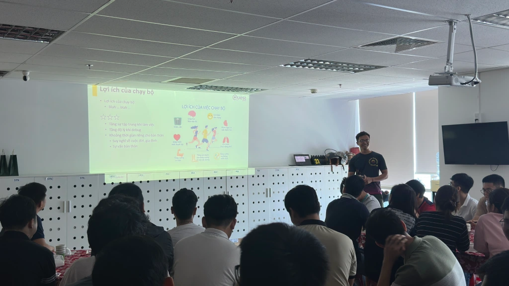 Office gathering with standing and seated attendees